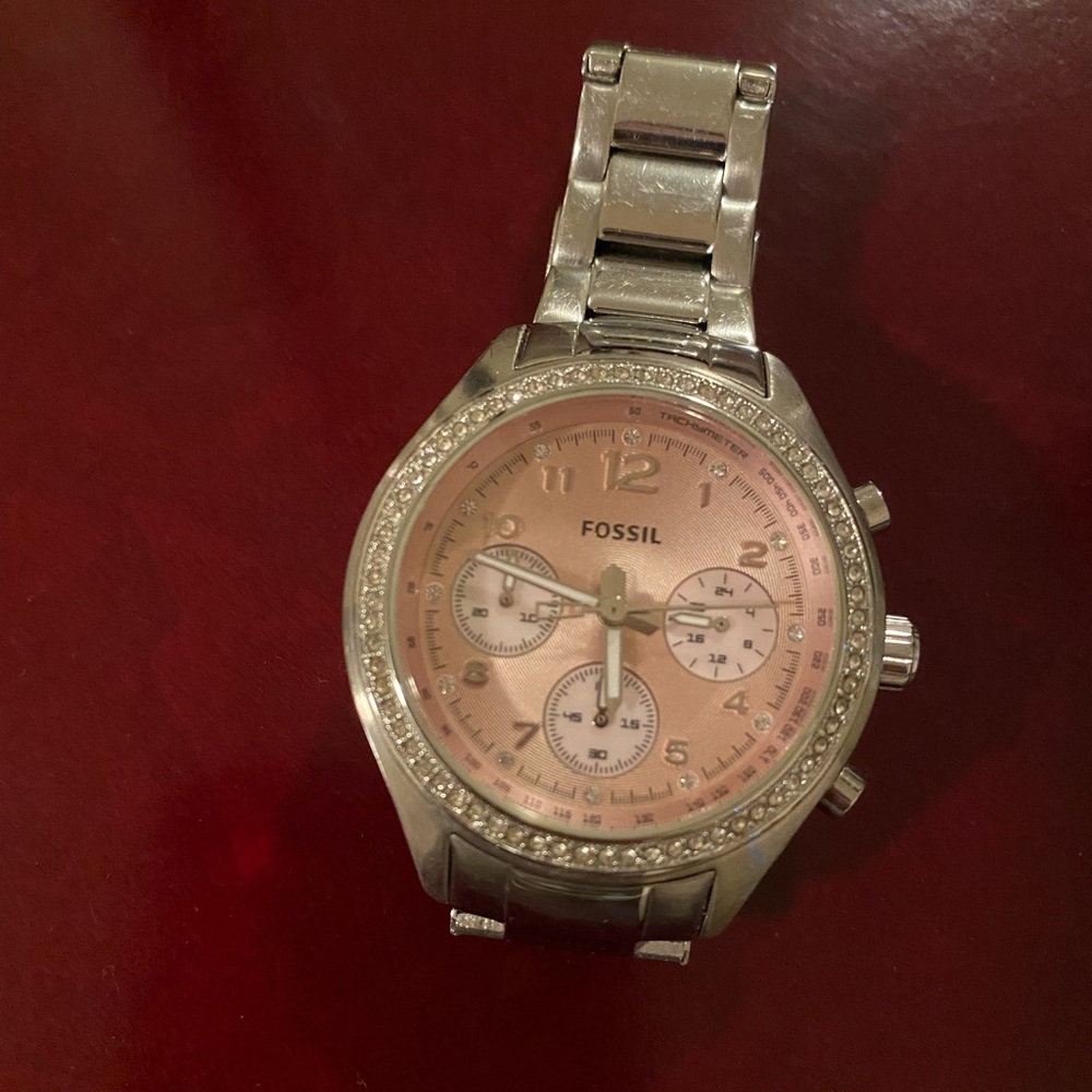 Stain steel watch pink face with stones on the bezel battery operated